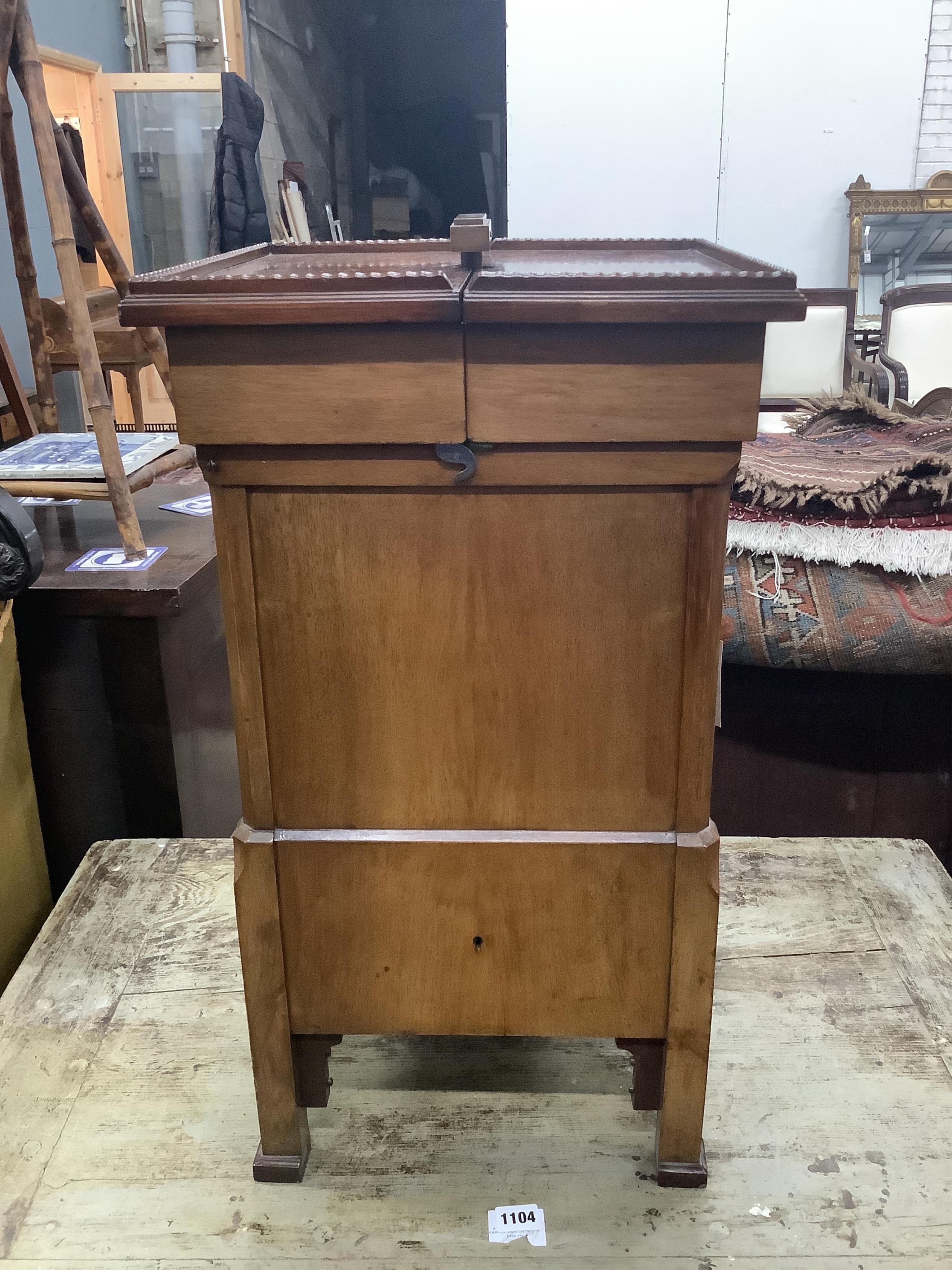 An early 20th century brass mounted mahogany 'Surprise' patent drink's cabinet, retailed by Goldsmiths & Silversmiths Co., width 37cm, depth 36cm, height 68cm. Condition - good